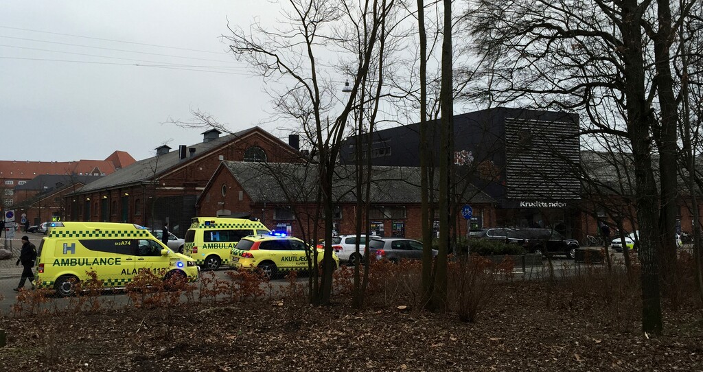 Emergency services gather outside a venue after shots were fired where an event titled  "Art, blasphemy and the freedom of expression" was being held in Copenhagen, Saturday, Feb. 14, 2015. Danish media say several shots have been fired at a cafe in Copenhagen where a meeting about freedom of speech was being held, organized by Swedish artist Lars Vilks, who has faced numerous threats for caricaturing the Prophet Muhammad in 2007. (AP Photo/Polfoto, Mikkel Tariq Khan) DENMARK OUT