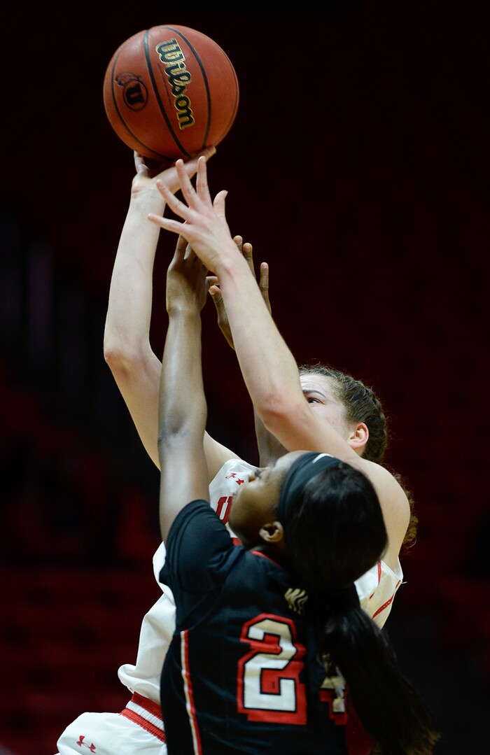(Francisco Kjolseth  |  The Salt Lake Tribune)  Utah Utes center Megan Huff (5) manages a basket and foul out of UNLV in the last second of the first half as Utah hosts UNLV in women's NCAA basketball at the Huntsman Center, Thursday, March 15, 2018.