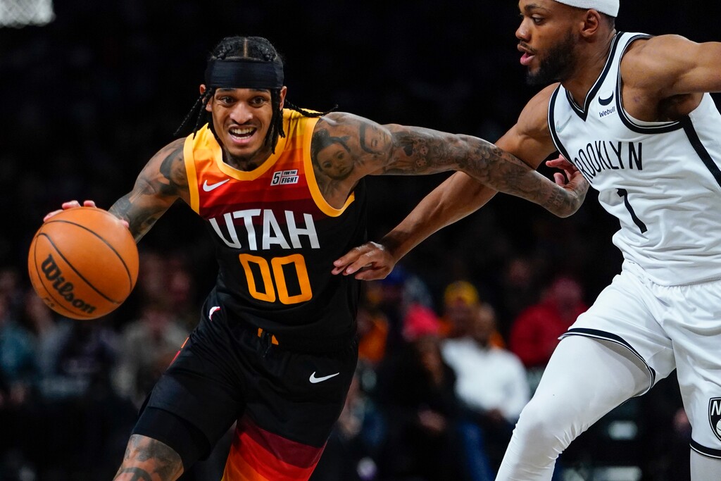 (Frank Franklin II | AP) Utah Jazz's Jordan Clarkson (00) drives past Brooklyn Nets' Bruce Brown (1) during the second half of an NBA basketball game Monday, March 21, 2022, in New York.