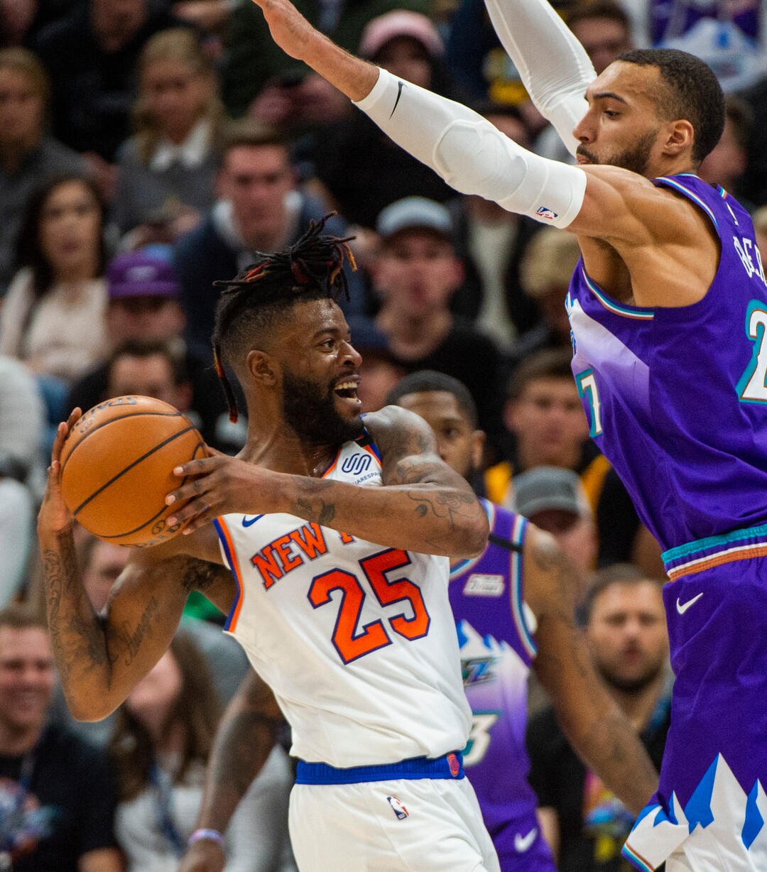 (Rick Egan  |  The Salt Lake Tribune) New York Knicks guard Reggie Bullock (25) trees to get rid of the ball, as Utah Jazz center Rudy Gobert (27) defends, in NBA action between the Utah Jazz and the New York Knicks, in Salt Lake City, Wednesday, Jan. 8, 2020.