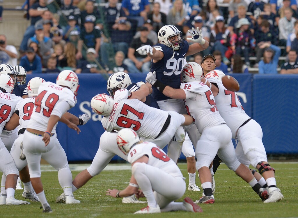 Leah Hogsten  |  The Salt Lake TribuneBrigham Young Cougars offensive lineman Corbin Kaufusi (90) swats SUU's  49-yard field goal attempt. Brigham Young University defeated Southern Utah University 37-7 during their first match up at LaVell Edwards Stadium,  Saturday, November 12, 2016.