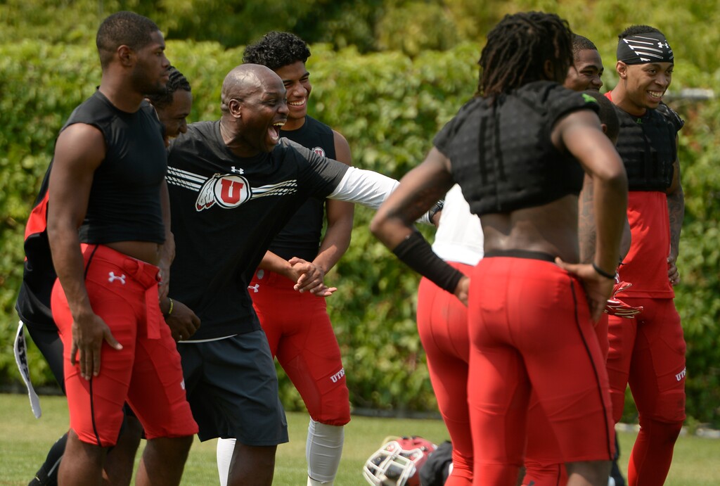 (Leah Hogsten  |  The Salt Lake Tribune)  University of Utah cornerbacks coach Sharrieff Shah jokes around with players after practice, Monday, August 6, 2018. Shah appears occasionally on "The Real Housewives of Salt Lake City."
