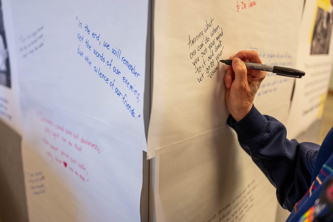 (Trent Nelson  |  The Salt Lake Tribune) Joan Gregory writes a quote on an interactive exhibit highlighting six figures in African American history at the University of Utah's Eccles Health Sciences Library in Salt Lake City on Thursday, Feb. 20, 2020.
