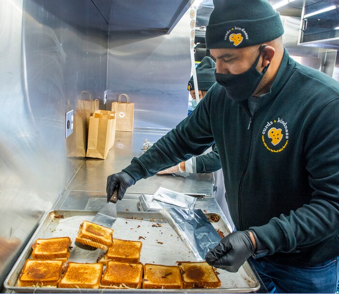 (Rick Egan | The Salt Lake Tribune)  makes grilled cheese sandwiches for 600 health care workers as part of the the Curds + Kindness program, which supports local dairy farmers, at the South Jordan Health Center in Daybreak on Tuesday, Dec. 1, 2020.