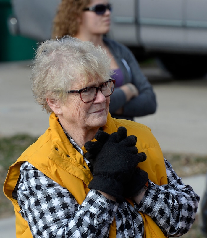 (Al Hartmann | The Salt Lake Tribune)
Clearfield public works personnel use a crane to remove Janis Zettel's gutted VW Beetle from a tree in her front yard Tuesday Feb. 13. She put it up a few months ago as an art installation. Now it has to come down. Zettel looks a little sad at it's lifted from the tree.