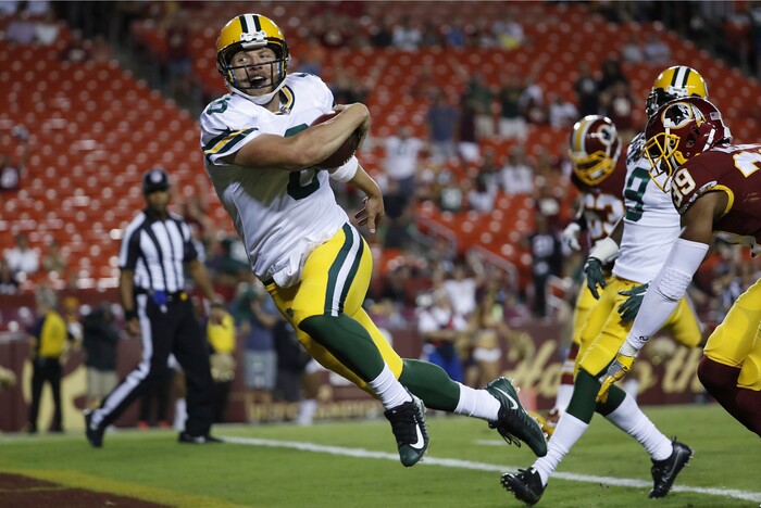 Green Bay Packers quarterback Taysom Hill (8) carries the ball into the end zone for a touchdown during the second half of an NFL preseason football game against Washington in Landover, Md., Saturday, Aug. 19, 2017. (AP Photo/Alex Brandon)