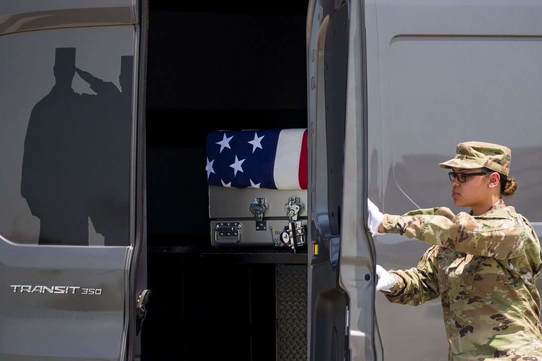 (Alex Brandon  |  AP Photo) Senior Airman Siannie Concepcion closes the doors on a vehicle containing a transfer case containing the remains of U.S. Army Sgt. 1st Class Elliott J. Robbins, at Dover Air Force Base, Del., Tuesday, July 2, 2019. According to the Department of Defense, Robbins, of Ogden, Utah, assigned to the 10th Special Forces Group died while supporting Operation Freedom's Sentinel.