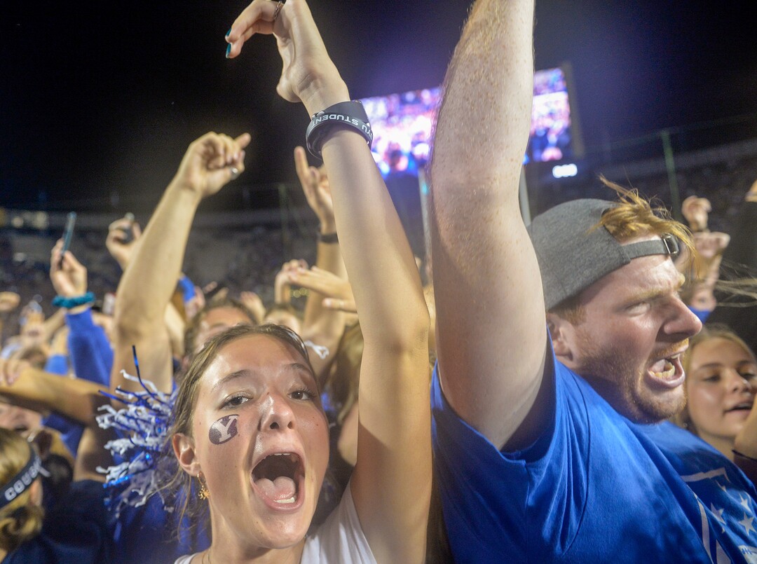 (Chris Samuels | The Salt Lake Tribune) Fans storm the field as the Brigham Young Cougars defeat the Utah Utes 26-17 in football, Saturday, Sept. 11, 2021 in Provo.