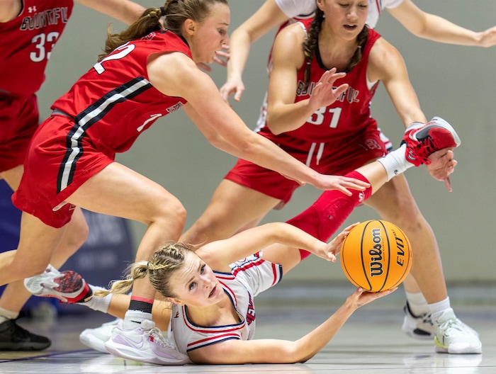 (Rick Egan | The Salt Lake Tribune) Springville Red Devil guard Ellie Esplin (1) tries to pass the ball as Bountiful Redhawks Ellyse Kessler (12) and Milika Satuala (31) defend, in the Girls 5A State Championship between the Springville Red Devils and the Bountiful Redhawks, at Weber State, on Saturday, March 4, 2023.
