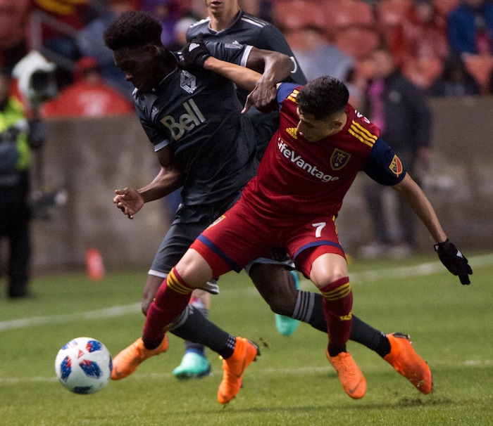 (Rick Egan  |  The Salt Lake Tribune)      Real Salt Lake forward Jefferson Savarino (7) goes for the ball along with Vancouver Whitecaps forward Alphonso Davies (67), in MLS action between Real Salt Lake and Vancouver Whitecaps, at Rio Tinto Stadium beSaturday, April 7, 2018.


