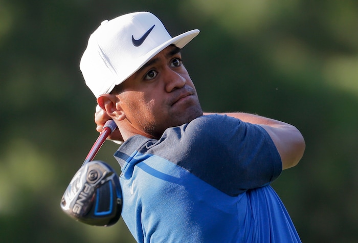 Tony Finau watches his tee shot on the third hole during the first round of the PGA Championship golf tournament at the Quail Hollow Club Thursday, Aug. 10, 2017, in Charlotte, N.C. (AP Photo/Chuck Burton)