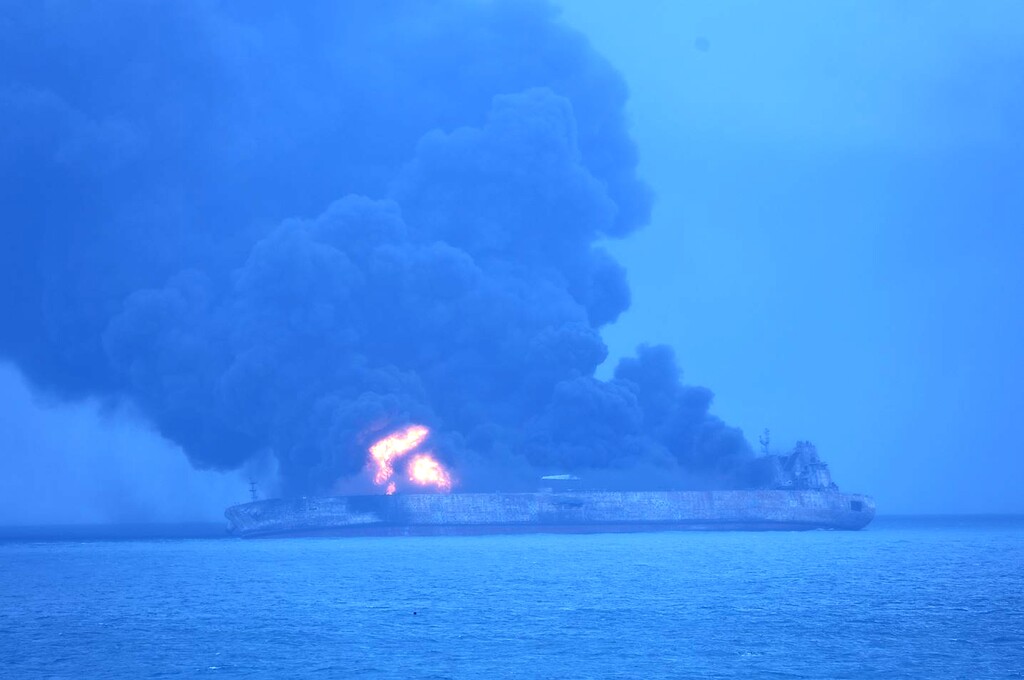 In this photo provided by Korea Coast Guard, the Panama-registered tanker "Sanchi" is seen ablaze after a collision with a Hong Kong-registered freighter off China's eastern coast Sunday, Jan. 7, 2018. The oil tanker collided with a bulk freighter and caught fire off China's eastern coast, leaving its entire crew of 32 missing, most of them Iranians, authorities said. (Korea Coast Guard via AP)