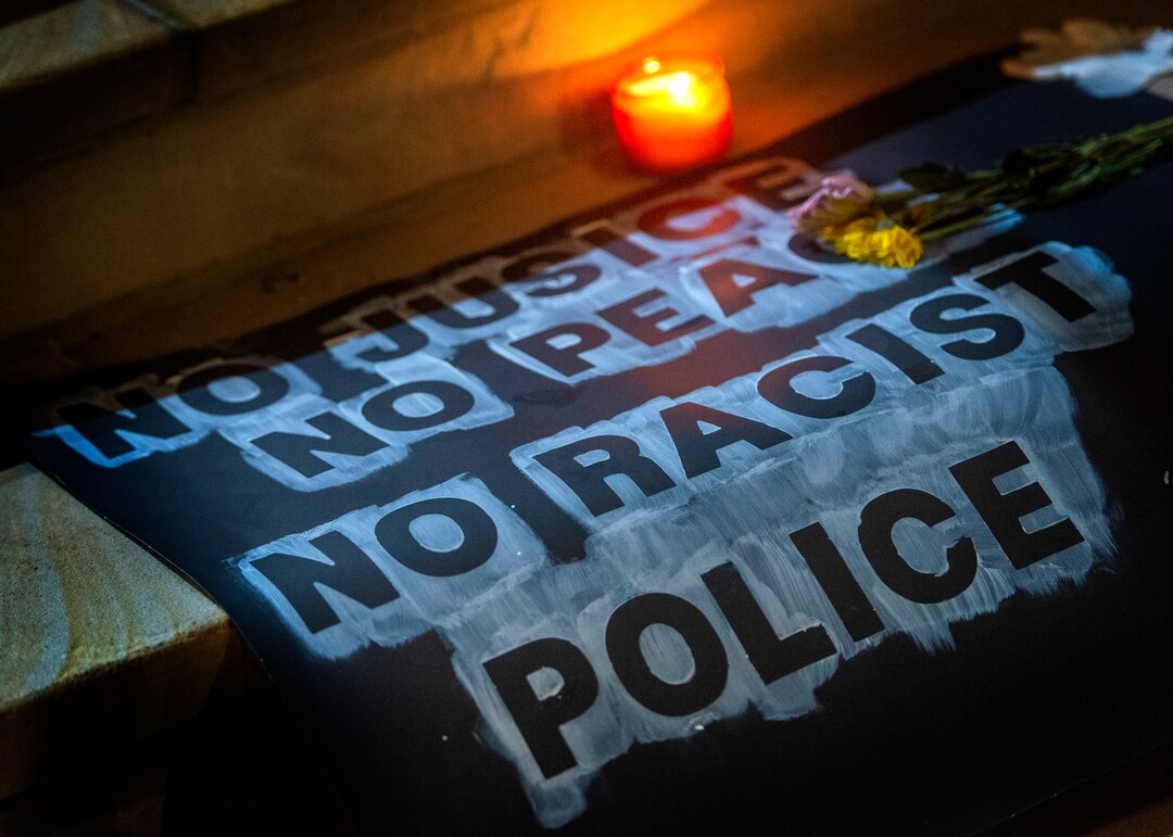 (Rick Egan  |  The Salt Lake Tribune)    Posters, flowers and candles line the steps of the Salt Lake City and County Building late at the evening after all the protesters were gone, Wednesday, June 3, 2020.