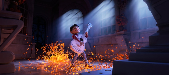 This image released by Disney-Pixar shows characters Miguel, voiced by Anthony Gonzalez in a scene from the animated film, "Coco." (Disney-Pixar via AP)