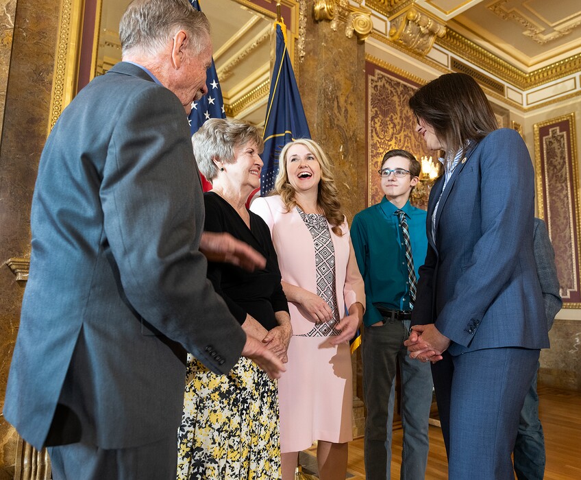 (Leah Hogsten | The Salt Lake Tribune) Judge Diana Hagen, center, laughs at her father Terry Roundy as her mother Denice Roundy and son Archer greet Lt. Gov. Deidre Henderson on Tuesday at the Capitol. Gov. Spencer J. Cox  nominated Utah Court of Appeals Judge Diana Hagen to serve as a Utah Supreme Court Justice, March 29, 2022. 