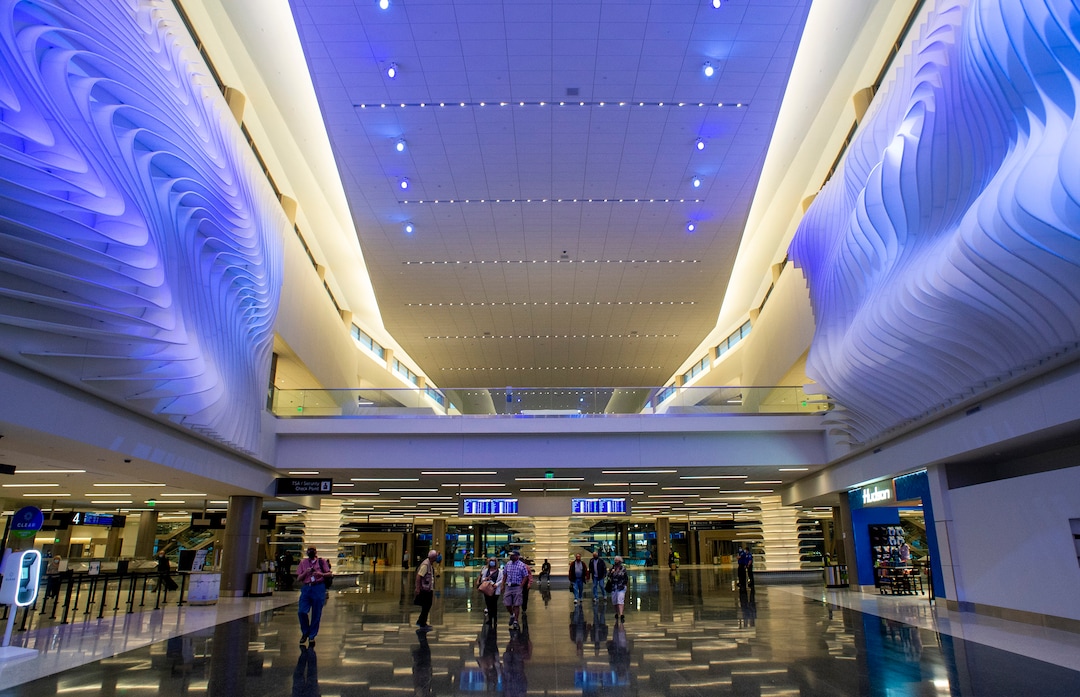 (Rick Egan  |  The Salt Lake Tribune)   Passengers and employees walk down the new terminal at the Salt Lake City International Airport on Tuesday, Sept. 15, 2020.
