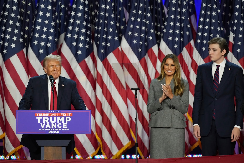 Donald Trump, joined Melania Trump and son Barron Trump, speaks at the Palm Beach County Convention Center during an election night watch party, Wednesday, Nov. 6, 2024, in West Palm Beach, Fla. (AP Photo/Lynne Sladky)
