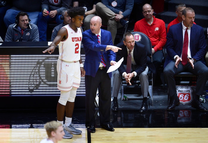 (Scott Sommerdorf   |  The Salt Lake Tribune)   Utah assistant coach Andy Hill speaks with Kolbe Caldwell during second half play. Utah defeated Eastern Washington 85-69, Friday, November 24, 2017. 