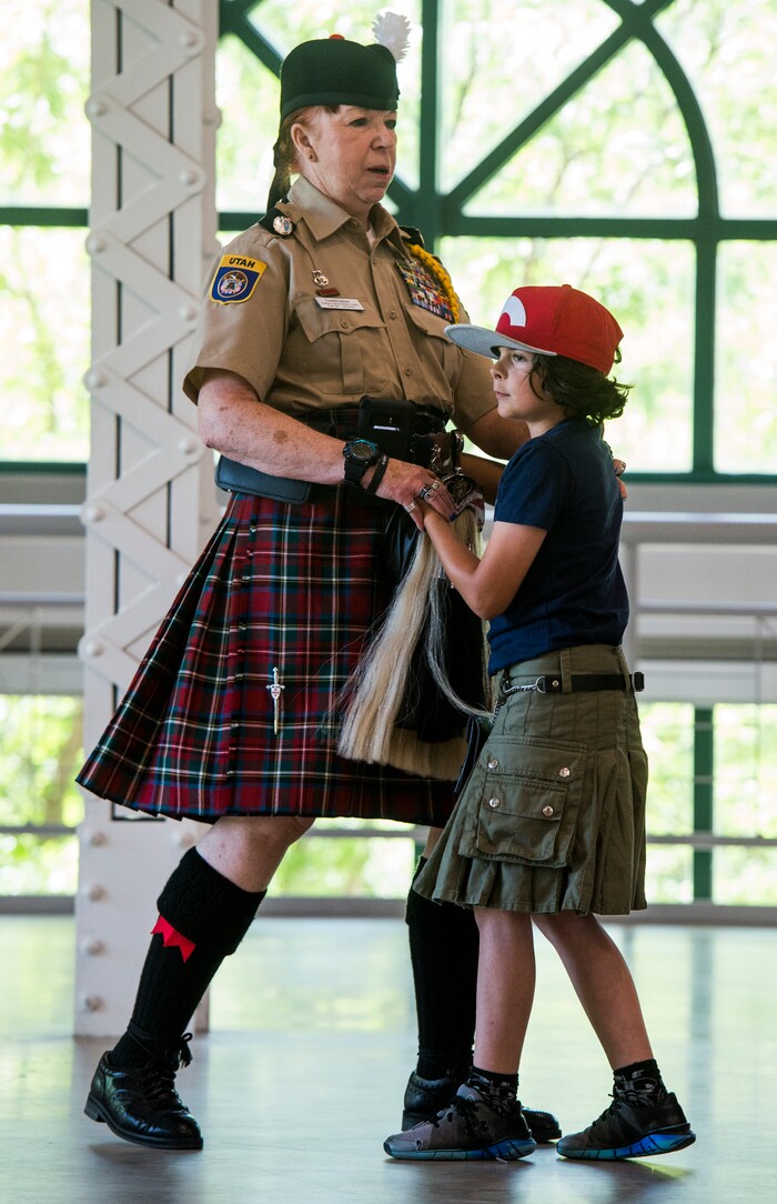 (Rick Egan  |  The Salt Lake Tribune)      Connie Carlson teaches 8-year-old Daniel Montgomery how to do a Scottish Country Dance, at the 44th annual Utah Scottish Festival and Highland Games at the Utah State Fairgrounds, Sunday, June 10, 2018.