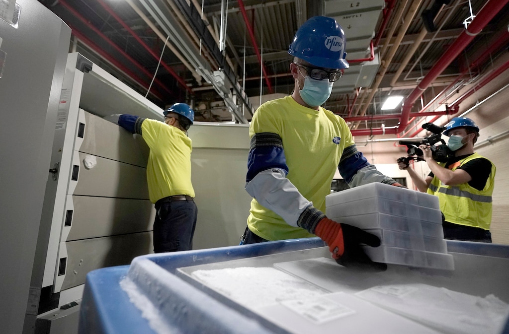 (Morry Gash | AP pool photo)  Boxes containing the Pfizer-BioNTech COVID-19 vaccine are prepared to be shipped at the Pfizer Global Supply Kalamazoo manufacturing plant in Portage, Mich., Sunday, Dec. 13, 2020.