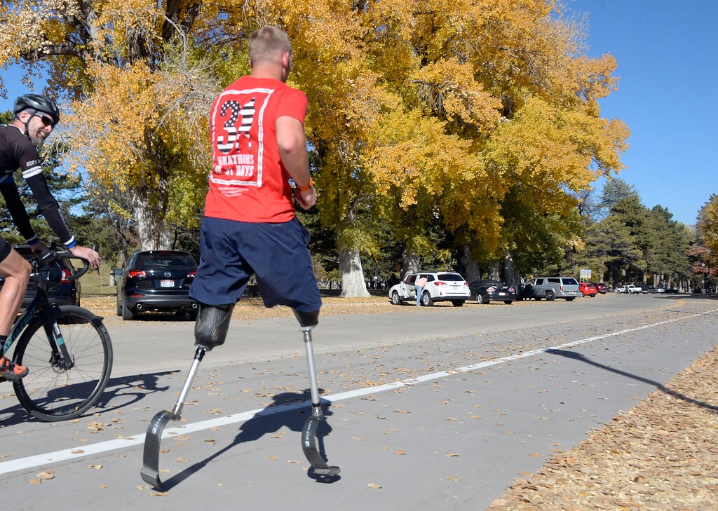 Al Hartmann  |  The Salt Lake Tribune) 	Rob Jones, a retired Marine Corps Sergeant who lost both legs when he stepped on an improvised explosive device in Afghanistan, runs a marathon, (26.2) miles in Liberty Park in Salt Lake City Wednesday Oct. 25. He won a Bronze Medal in the Paralympics and he wis the first and only double above the knee amputee to ride a normal bicycle 5,180 miles across America. Now, he is set to run 31 marathons in 31 days in 31 major cities. Starting in London on October 12th, and continuing in the United States and Toronto, he will run 26.2 miles in the selected city on his own, travel to the next city, and repeat, ending appropriately on Veterans Day in our Nation’s Capital.  His motto, “Survive. Recover. Live.” 