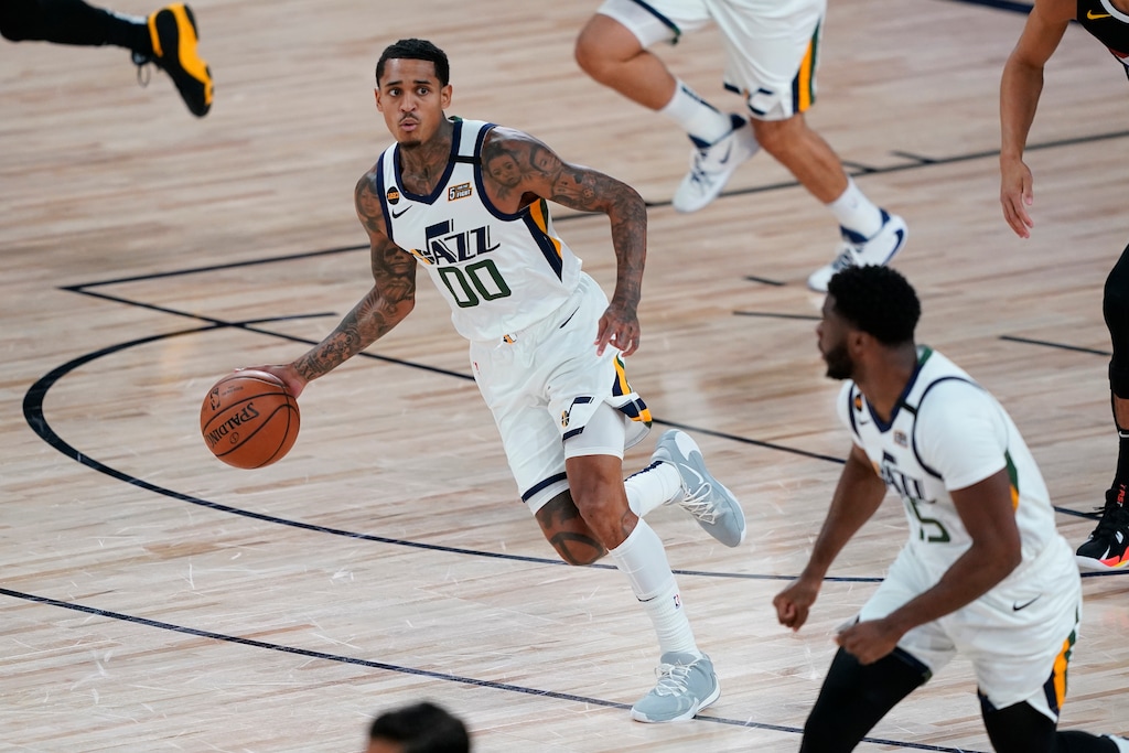 Utah Jazz's Jordan Clarkson (00) moves the ball up court against the Denver Nuggets during the first half of an NBA basketball first round playoff game, Monday, Aug. 3, 2020, in Lake Buena Vista, Fla.(AP Photo/Ashley Landis, Pool)