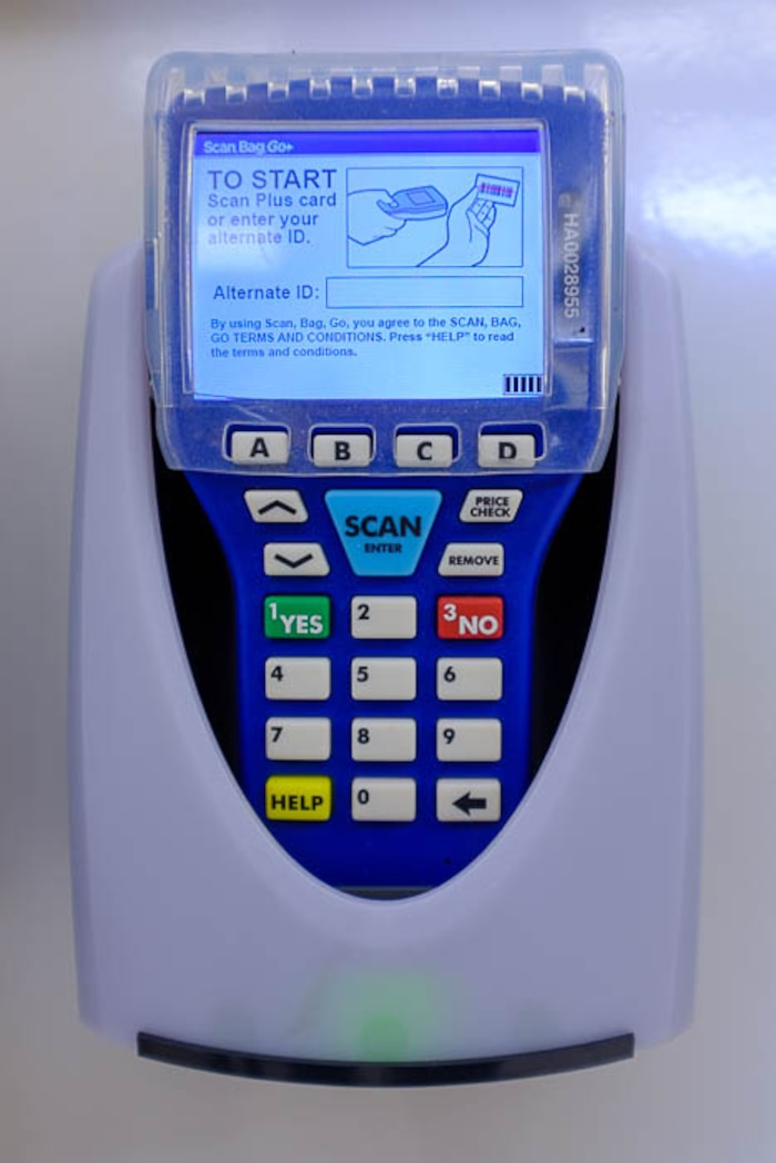 (Trent Nelson | The Salt Lake Tribune)  
Smith's has introduced handheld scanners to five Utah stores - where shoppers carry a small device and scan and bag their groceries as they walk through the aisles. Monday April 16, 2018.