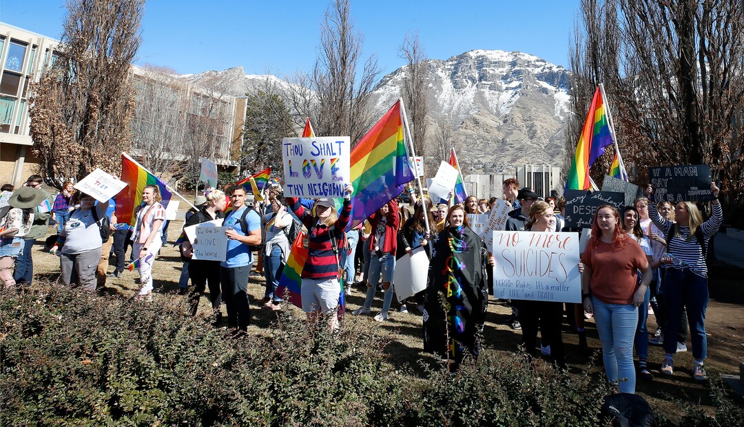 (George Frey  |  special to The Salt Lake Tribune) BYU students and others gather in front of the Ernest L. Wilkinson Student Center on the campus of Brigham Young University to protest BYUÕs rollback of a newly announced policy change on LGBTQ students on March 5, 2020 in Provo, Utah.