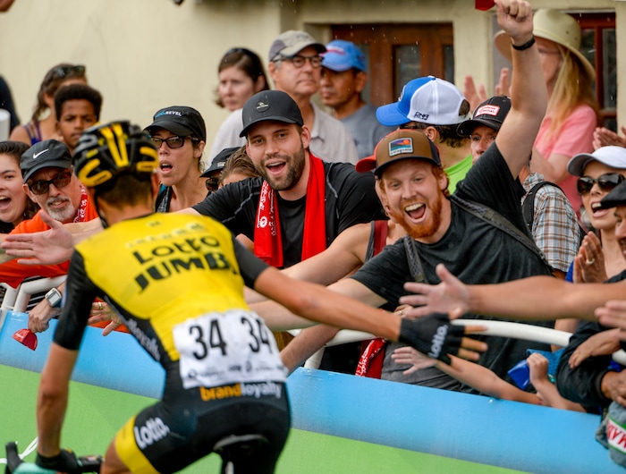 Leah Hogsten | The Salt Lake Tribune Daan Olivier with team Lotto NL-Jumbo slaps the hands of fans lining Park City's Main Street at the finish of the Tour of Utah's Stage 6, Sunday, August 12, 2018.