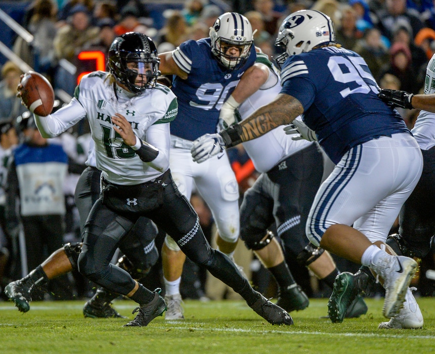 Leah Hogsten  |  The Salt Lake Tribune  | BYU defensive tackle Khyiris Tonga (95), shown here chasing Hawaii QB Cole McDonald (13), says he will forego his senior season and leave early for the NFL draft if his upcoming junior season goes well.