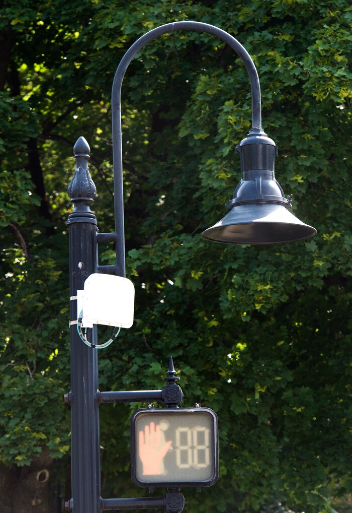 (Rick Egan  |  The Salt Lake Tribune)      The white box on the left is one of ten traffic signal detectors, Salt Lake City has installed, that uses a radar device that is triggered by people riding bicycles. Wednesday, Aug. 1, 2018.


