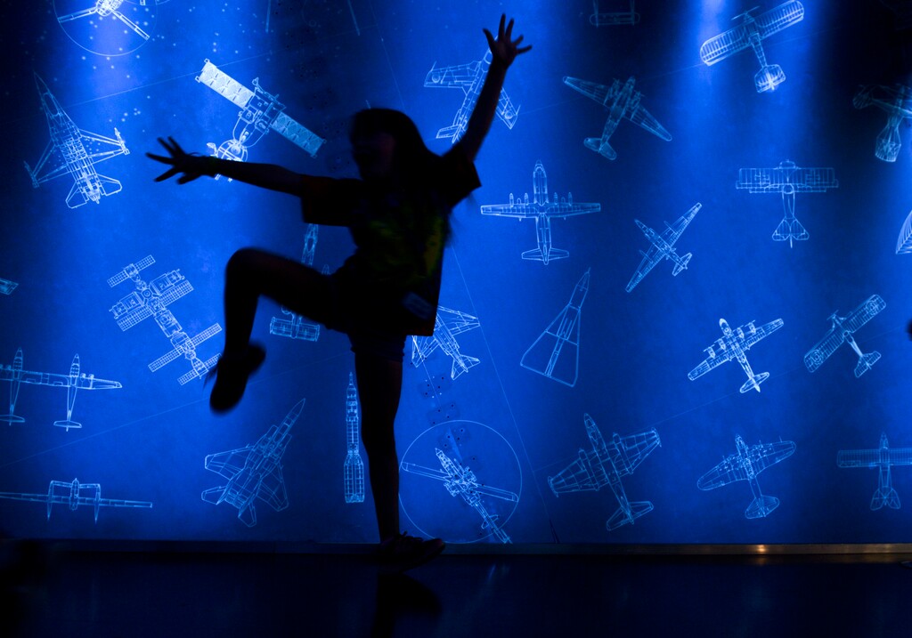 Leah Hogsten | The Salt Lake Tribune A summer camp student is silhouetted against the flight exhibit, Wednesday, August 8, 2018 at The Leonardo Museum. Three months ago, The Leonardo faced an uncertain future and was millions in debt, but now a third of the museum's creditors have forgiven about 20 percent of its total debt outright.