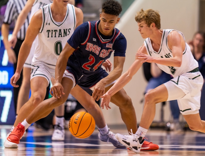(Rick Egan | The Salt Lake Tribune) 
Woods Cross, forward, Mason Bendinger (24) goes for a loose ball along with Olympus guard Luke Lowe (3), in the 5A State Championship game between Woods Cross and Olympus, at the Marriott Center in Provo, on Saturday, March 5, 2022. 
