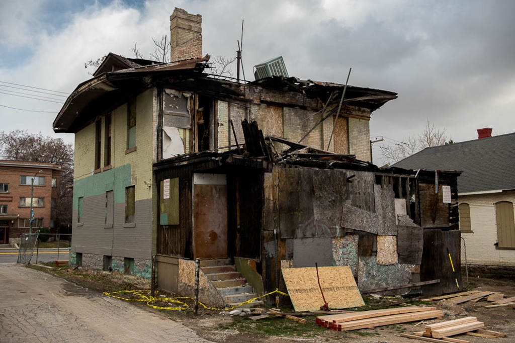 (Trent Nelson | The Salt Lake Tribune)  A dilapidated, fire-damaged building near 100 South 700 East in Salt Lake City is scheduled to be demolished for the neighboring Other Side Academy's expansion.