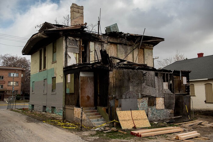 (Trent Nelson | The Salt Lake Tribune) A dilapidated, fire-damaged building near 100 South 700 East in Salt Lake City, Thursday Feb. 15, 2018. Other Side Academy has received approval to demolish it for their expansion.