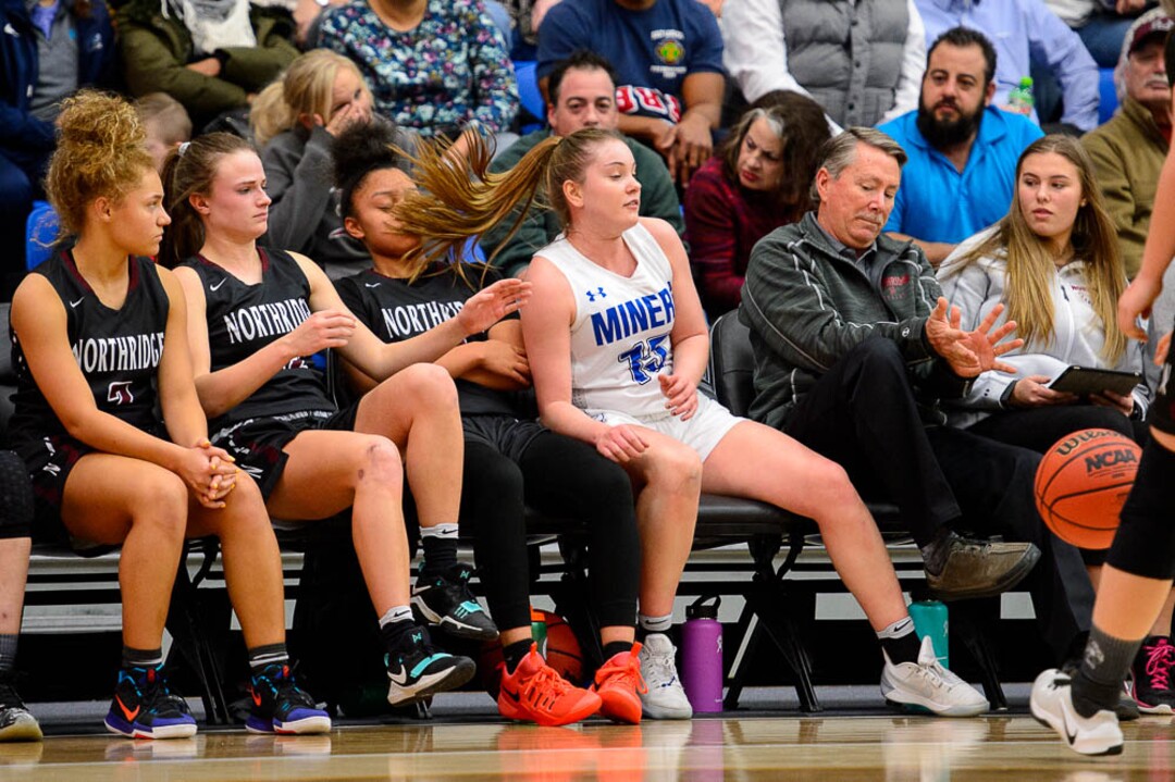 (Trent Nelson | The Salt Lake Tribune)  Bingham's Maggie McCord (15) chases a loose ball onto the Northridge bench as Bingham faces Northridge in the 6A High School Girls' Basketball Tournament at SLCC in Taylorsville, Thursday Feb. 22, 2018.