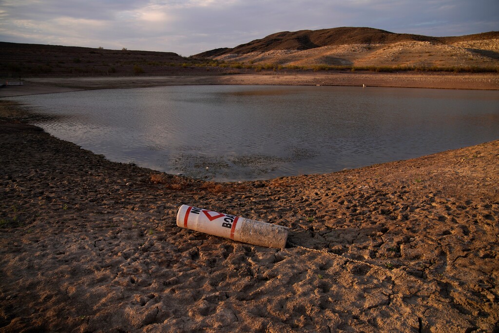 (AP Photo | John Locher) A buoy rests on the ground at a closed boat ramp on Lake Mead at the Lake Mead National Recreation Area near Boulder City, Nev. The U.S. Bureau of Reclamation released projections Wednesday, Sept. 22, 2021, that indicate an even more troubling outlook for a river that serves millions of people in the U.S. West. The agency recently declared the first-ever shortage on the Colorado River, which means Arizona, Nevada and Mexico won't get all the water they were allocated next year.
