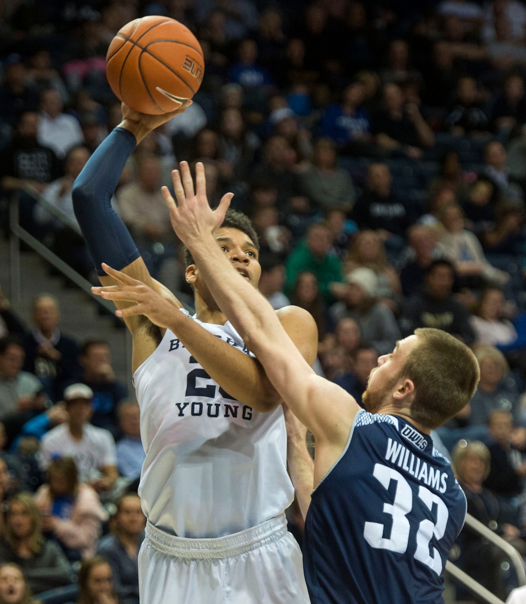 (Rick Egan  |  The Salt Lake Tribune)   Rice Brigham Young Cougars forward Yoeli Childs (23) shoots over Rice Owls forward Jack Williams (32), in basketball action between Brigham Young Cougars and Rice Owls, at the Marriott Center in Provo, Wednesday, Nov. 21, 2018.