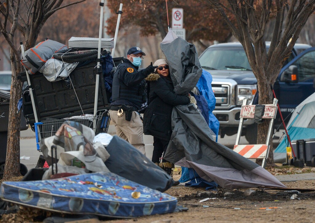 (Leah Hogsten  |  The Salt Lake Tribune) Tensions flared between protesters and police in downtown Salt Lake City on Thursday, Dec. 10, 2020 as dozens of people experiencing homelessness were forced to leave the camps where they were living.