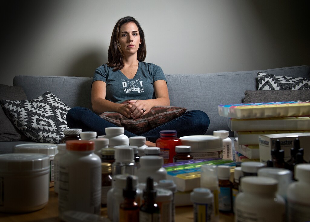 (Leah Hogsten | The Salt Lake Tribune) Singer-songwriter Emme Packer-Koons believes she may have been better able to pursue a music career had she been diagnosed earlier with Lyme disease. Packer-Koons said her days in her darkened home revolve around pain management, including taking dozens of pills and herbal and flower tinctures and smoothing topical treatments on her knees and joints to alleviate inflammation.