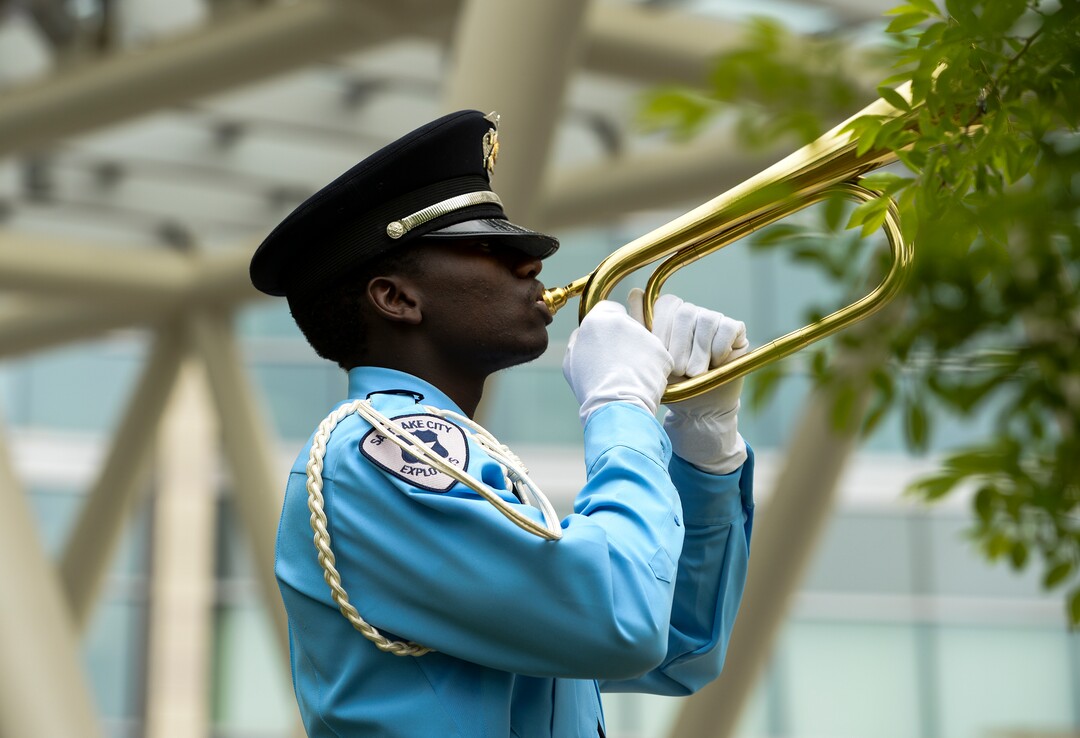 (Leah Hogsten  |  The Salt Lake Tribune)  Salah Eftin, a Salt Lake City Explorer honor guard member plays Taps during the ceremony.  In honor of Police Week, the Salt Lake City Police Department honored its fallen officers with a memorial service and a 21-gun salute at the Public Safety Building, Thursday, May16, 2019.