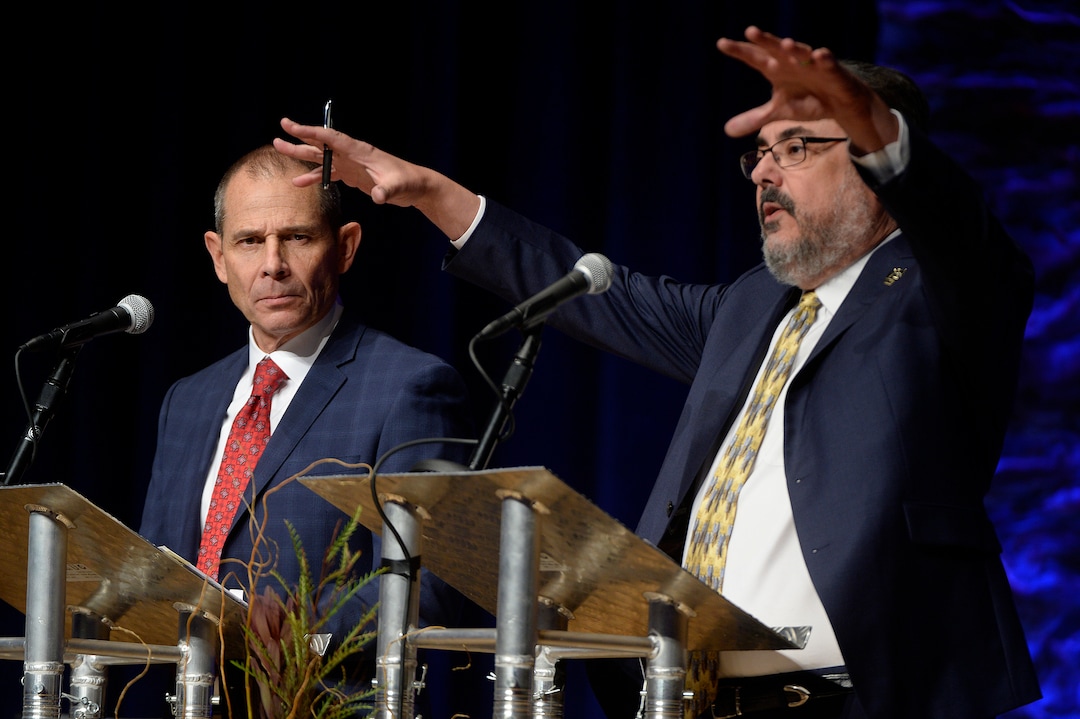 (Scott Sommerdorf   |  The Salt Lake Tribune)   Mayor John Curtis, left, listens as Joe Buchman makes  appoint during Utah's 3rd District Congressional debate, Friday, October 13, 2017. 