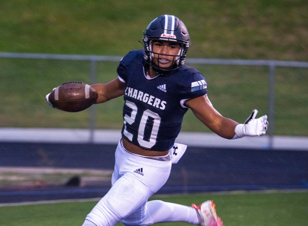 (Rick Egan | The Salt Lake Tribune) Tre Kofe (20) scores a touchdown for the Chargers, in prep football action between Corner Canyon Chargers and the East Leopards, on Saturday, Aug. 21, 2021.