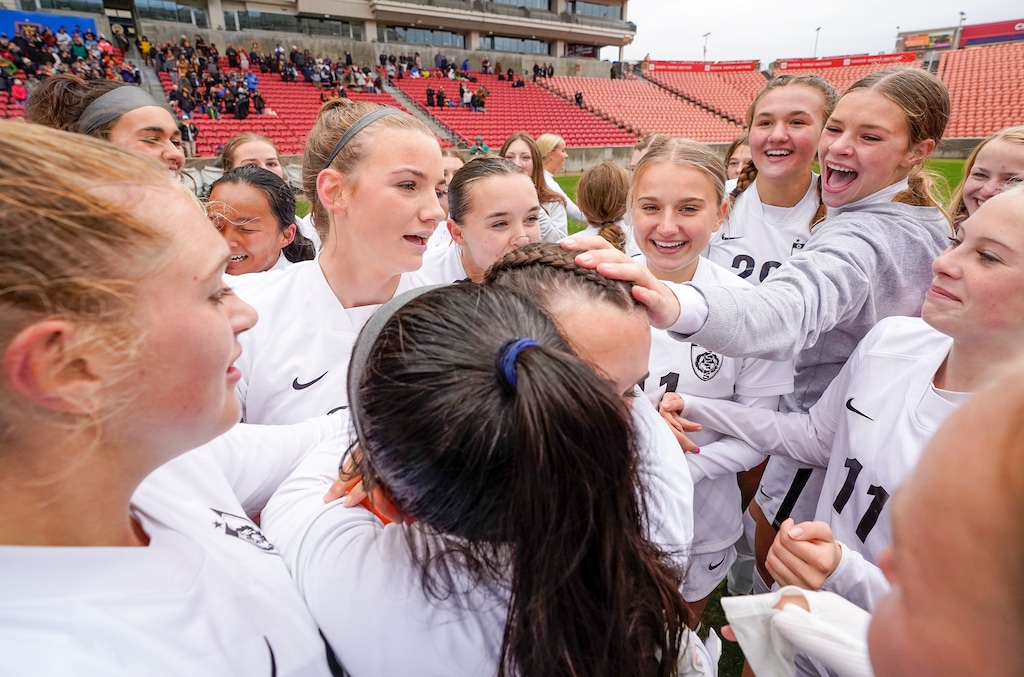 (Leah Hogsten | The Salt Lake Tribune) Ogden celebrates goalie Emily Blackford, crediting her with the win and shouting "MVP." Ogden High School defeated Morgan High School, 1-0, to win the 3A State Soccer Championship game Oct. 23, 2021 at Rio Tinto Stadium.