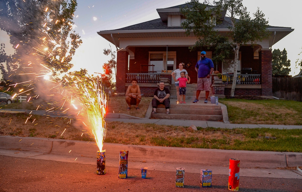 (Francisco Kjolseth  |  The Salt Lake Tribune) Family members stage their own holiday fireworks show in front of their home along 500 East near Liberty Park in Salt Lake City on Saturday, July 4, 2020. This year, such a display would not be allowed under the mayor's citywide ban.