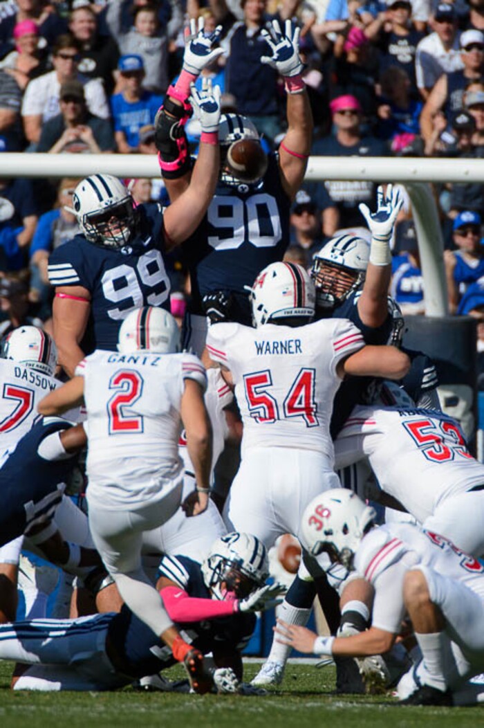 (Trent Nelson | The Salt Lake Tribune)  
BYU defenders leap in an attempt to block a field goal by Northern Illinois Huskies place kicker Andrew Gantz (2) as BYU hosts Northern Illinois, NCAA football in Provo, Saturday Oct. 27, 2018. The kick was no good.