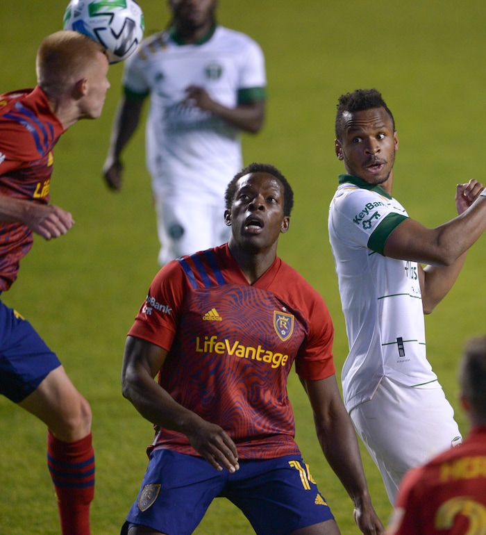 (Leah Hogsten  |  The Salt Lake Tribune) Real Salt Lake defender Nedum Onuoha (14) watches as Real Salt Lake defender Justen Glad (15) takes a header as Real Salt Lake hosts the Portland Timbers, Oct. 14, 2020.