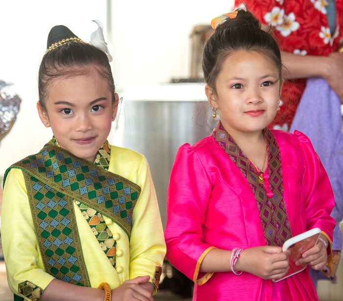 (Rick Egan  |  The Salt Lake Tribune)   Kandra 7, and Daisee  8, wear their traditional clothes for the Wat Lao Salt Lake Buddharam Utah, New Year Celebration, in West Valley City, Sunday, April 28, 2019.


