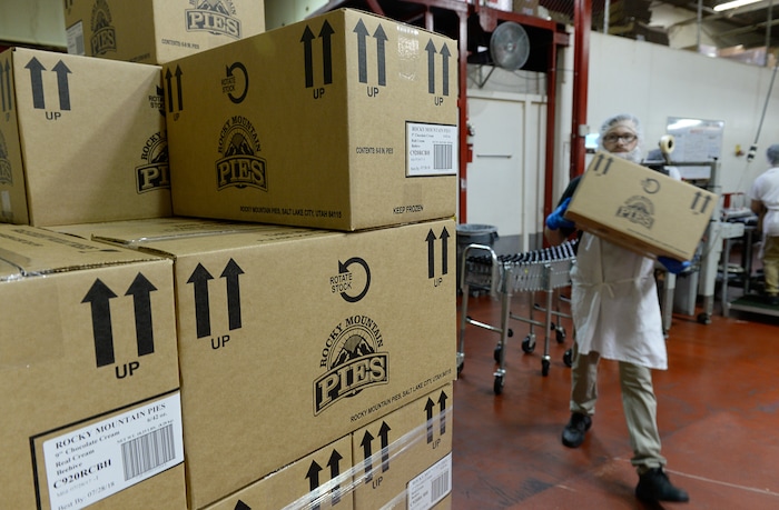Francisco Kjolseth | The Salt Lake TribuneCrews load boxes of Chocolate Cream pies produced at Rocky Mountain Pies in Salt Lake for Beehive Bread and Pastry recently. 