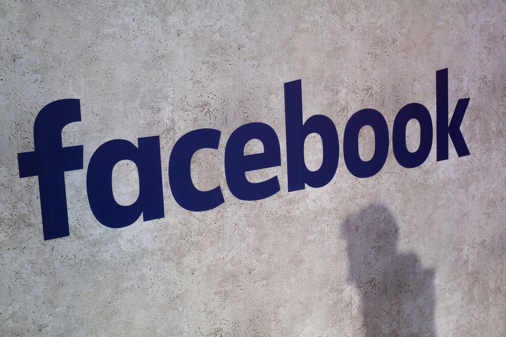(Thibault Camus | The Associated Press) This Jan. 17, 2017, file photo shows a Facebook logo being displayed in a start-up companies gathering at Paris' Station F.  Facebook is on the offensive to try to contain swirling concerns about how it protects the data of its 2.2 billion members. As CEO Mark Zuckerberg prepares to face Congress on Tuesday, April 10, 2018, and the company rolls out new privacy rules, the social media juggernaut is facing the most serious challenge in its 14-year-history and seeking to maintain people’s trust and avoid a user exodus.